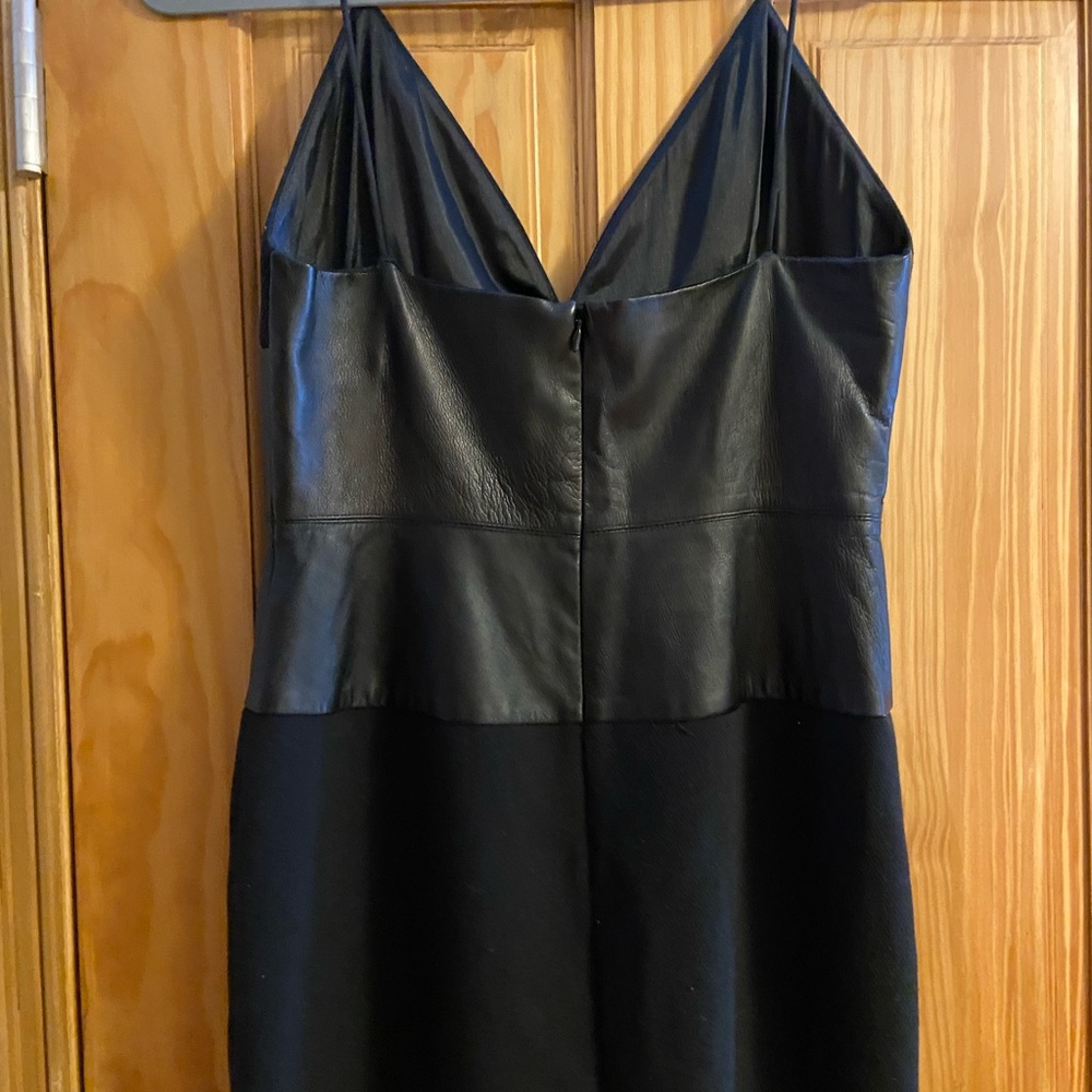 Black crepe and leather knee length dress